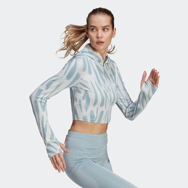 Adidas cropped running hoodie with blue and white print, paired with light blue leggings.